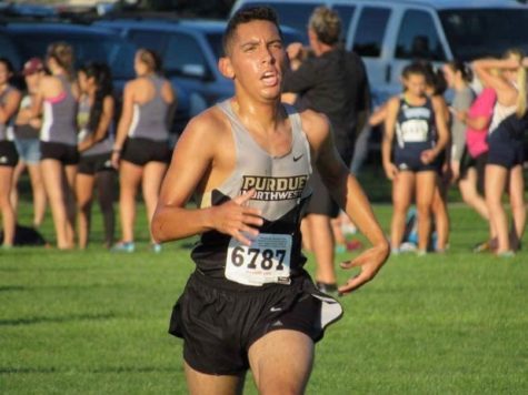 Christopher Ramos, freshman dentistry major, keeps the pace at the St. Francis Twilight Invite 5k on Sept. 2.