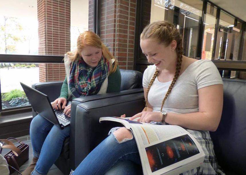 Cassandra Obinger (left) and Amanda Knight (right), study together in front of the Welcome Center in SUL. 
