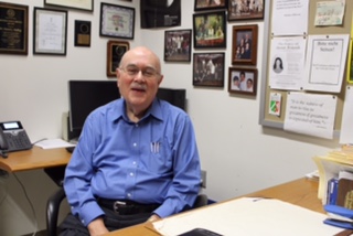 Dr. Padberg enjoys the break from teaching class in his office. 