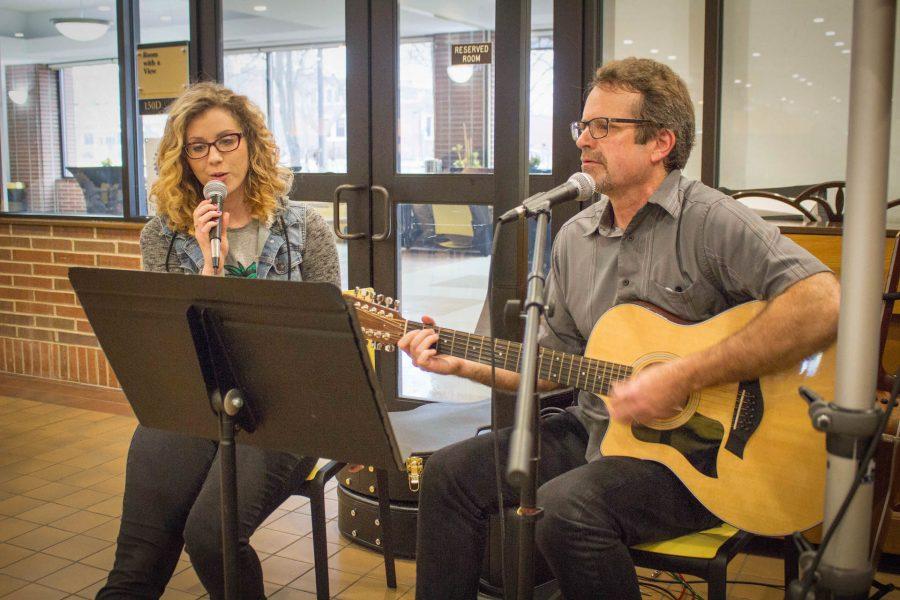 Ashley Peterson (left) and TJ Holsen (right) sing acoustic renditions of classic rock and pop songs on Feb. 22.