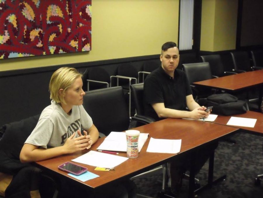 Club President Anna Gianna and member Mark Holcomb discuss members plans at the end of the second meeting of the PNW College Republicans in SUL 321 on March 20. 