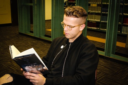 Matt Scheffer, junior business management major, spends his off hour catching up on reading
in the library.