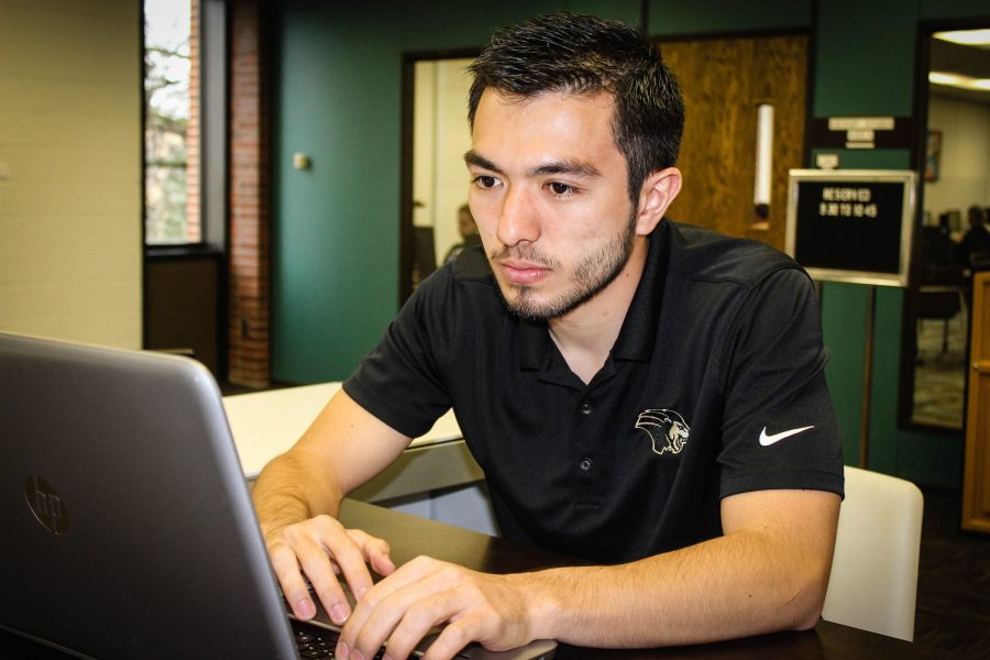 Murilo Cunha, junior mechanical engineering major, studies in the library. 