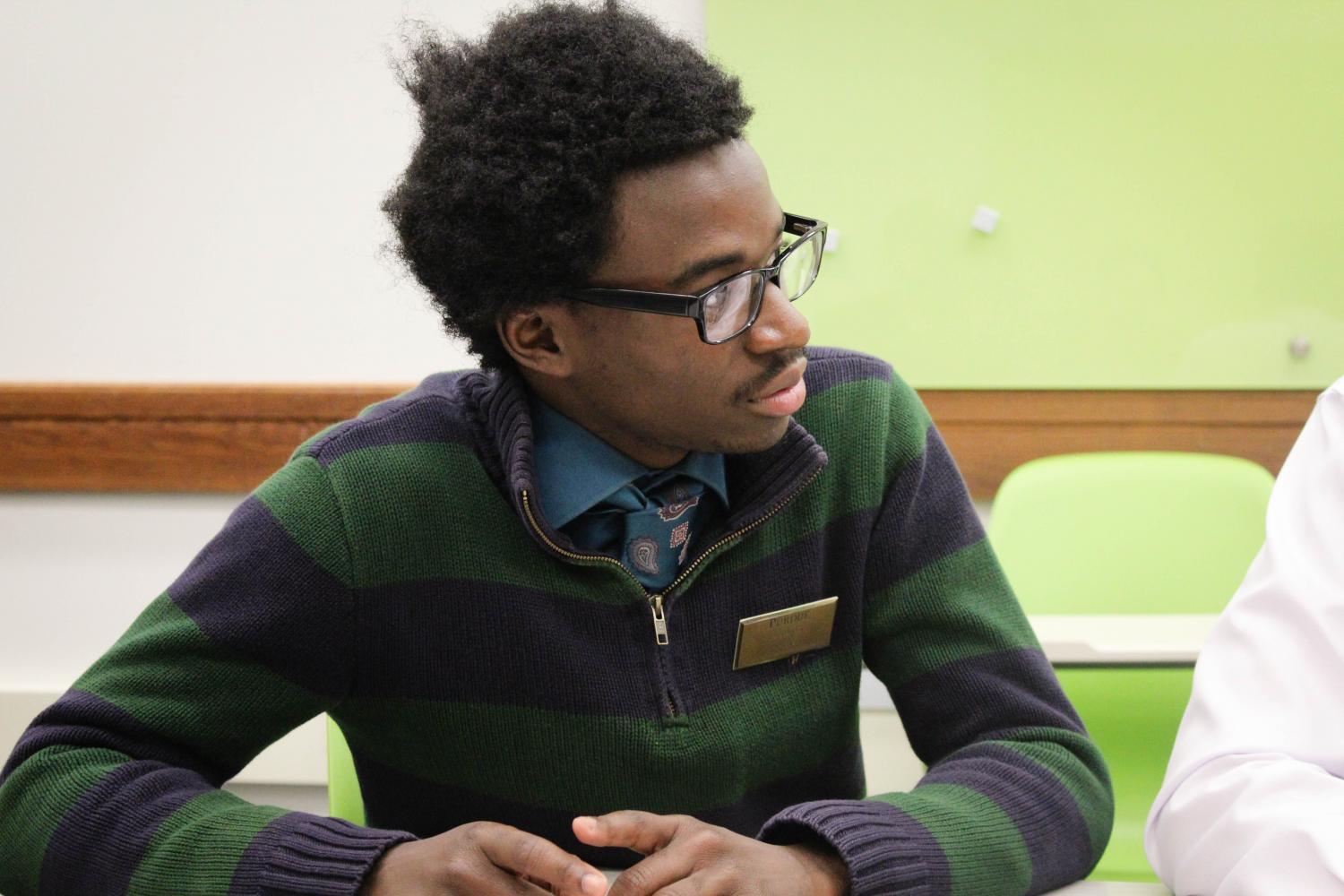 Daquan Williams, junior communication major, sits in on his first SGA meeting as president.