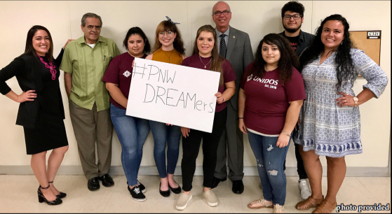 Members of Social Work Club and Unidos pose for a picture with Chancellor Thomas L. Keon
(center), Jose Bustos (next to left) and Mayra Rodriguez (left) who also spoke at the event.