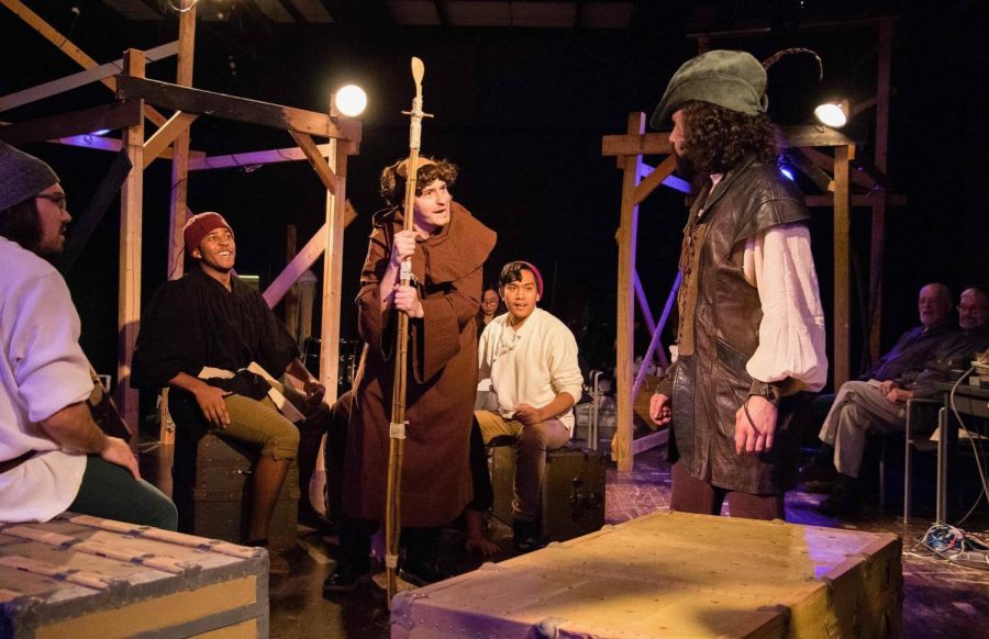Friar Tuck (front left), played by Jake Johnston, and Robin Hood (right), played by Cristian Galvan, discuss Robin entering the archery tournament. The Merry
Men, played by Steven Ulam, Isaac Tolliver, Niko Cabela (from left to right) listen.