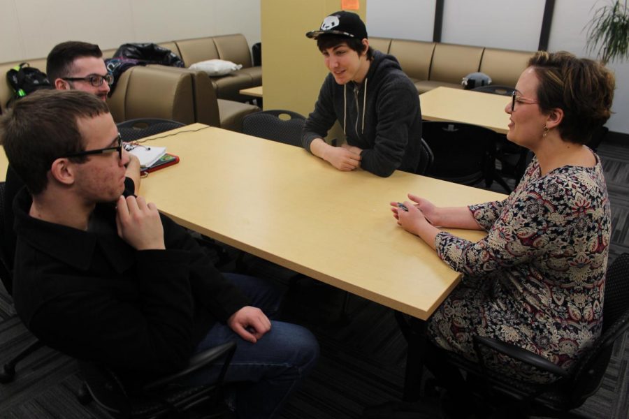 Natalie Beckley (right) introduces herself to Joshua Copeland, sophomore computer engineering
major; Liam Ahearn, sophomore mathematics major; and Jacob Widowfield, freshman computer science major (left to right).