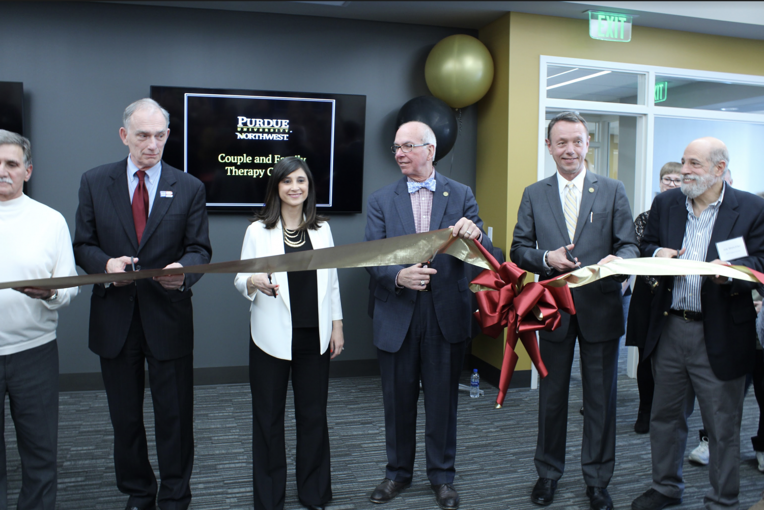 U. S. Rep. Pete Visclosky, Z. Seda Gulvas, interim director of the Couple and Family Center, Chancellor Thomas Keon and Provost Ralph Mueller cut the ribbon at the opening ceremony.