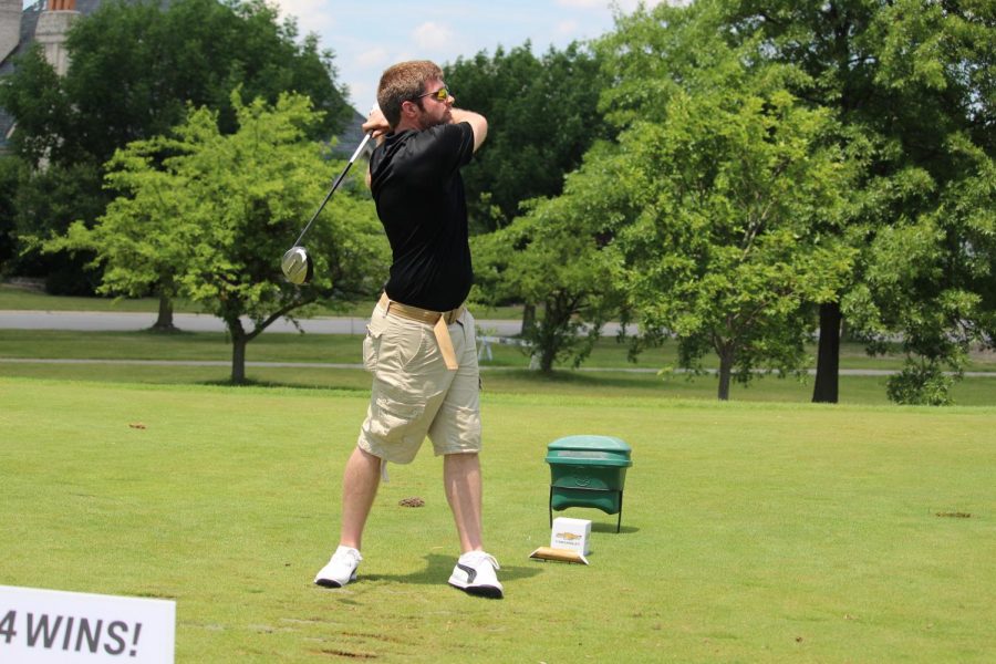 Michael Peterson, PNW information systems programmer, takes a swing at the outing. 