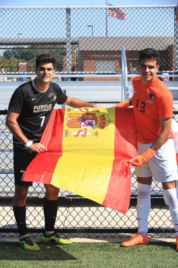 Enrique Serna, forward, and Raul Garrido Garcia, freshman goalkeeper,
represent their home country before a game.