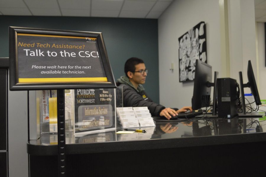 Jason Centeno, sophomore electrical engineering major waits to assist students in the new CSC location in the PNW Library at SULB.
