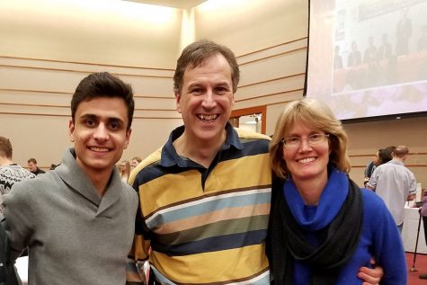 Abdullah Al-Abdal shares a moment with Tom and Amy Berube, who have hosted the PNW student at their Valparaiso home for three years.  Al-Abdal is the latest of 14 students the Berubes have hosted during the last eight years. 