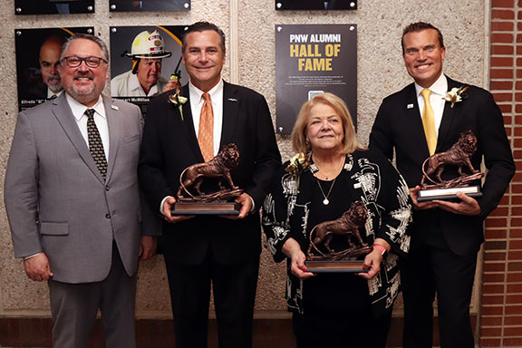 Chancellor Chris Holford (left) welcomed the three new Alumni Hall of Fame Inductees (from center left) Hammond Mayor Thomas McDermott Jr., former Judge Diane Kavadis Schneider, president and CEO of Indiana Grocery Group