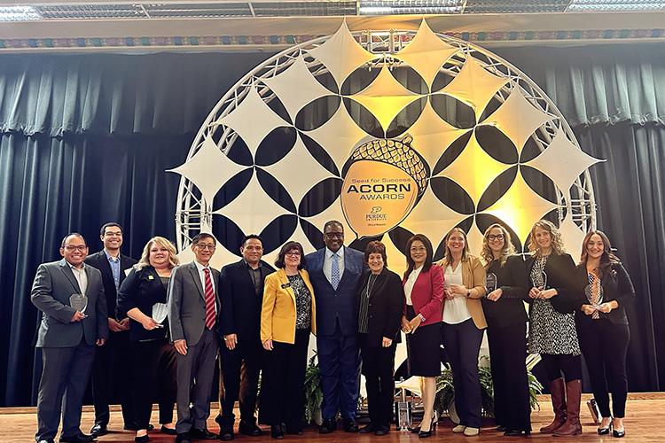 Several PNW faculty and staff were recognized by Purdue’s Office of Research for impactful scholarly initiatives that have attracted millions of dollars in external funding. Pictured, from left: Armin Silaen; Ty Okosun, Debbie Blades, Keyuan Jiang, Michael Tu, Provost Marie T. Mora, Purdue University Trustee Shawn A. Taylor, Purdue EVP for Research Karen Plaut, Chenn Zhou, Katie Bowers, Anne Gregory, Carly Baetz and Amanda Zelechoski. (PNW photo)