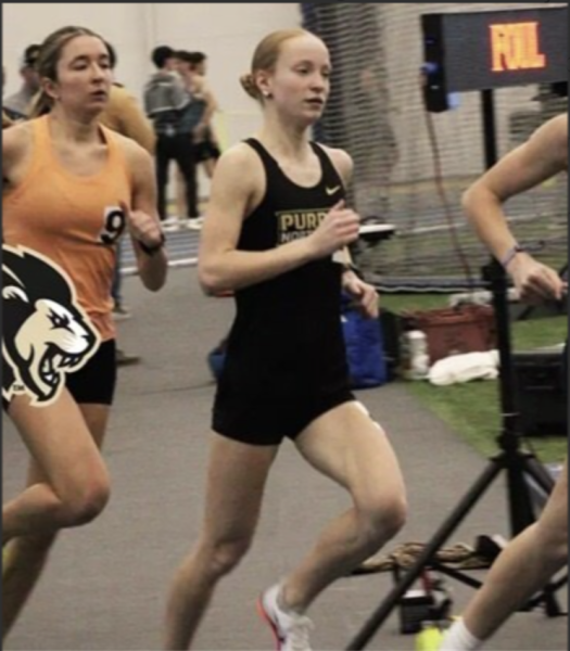 Sara McGraw, a distance runner on the Pride team, be-
lieves new coaches have inspired the team to improve

their performance. (PNW Athletics photo)