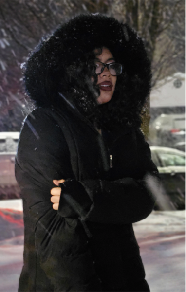 Like so many students, Henny Ovando strives to make
fashion statement while staying warm this freezing
winter.